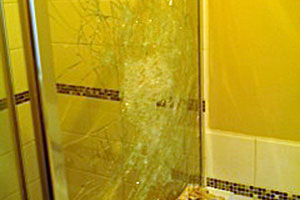 Broken glass shower screen.